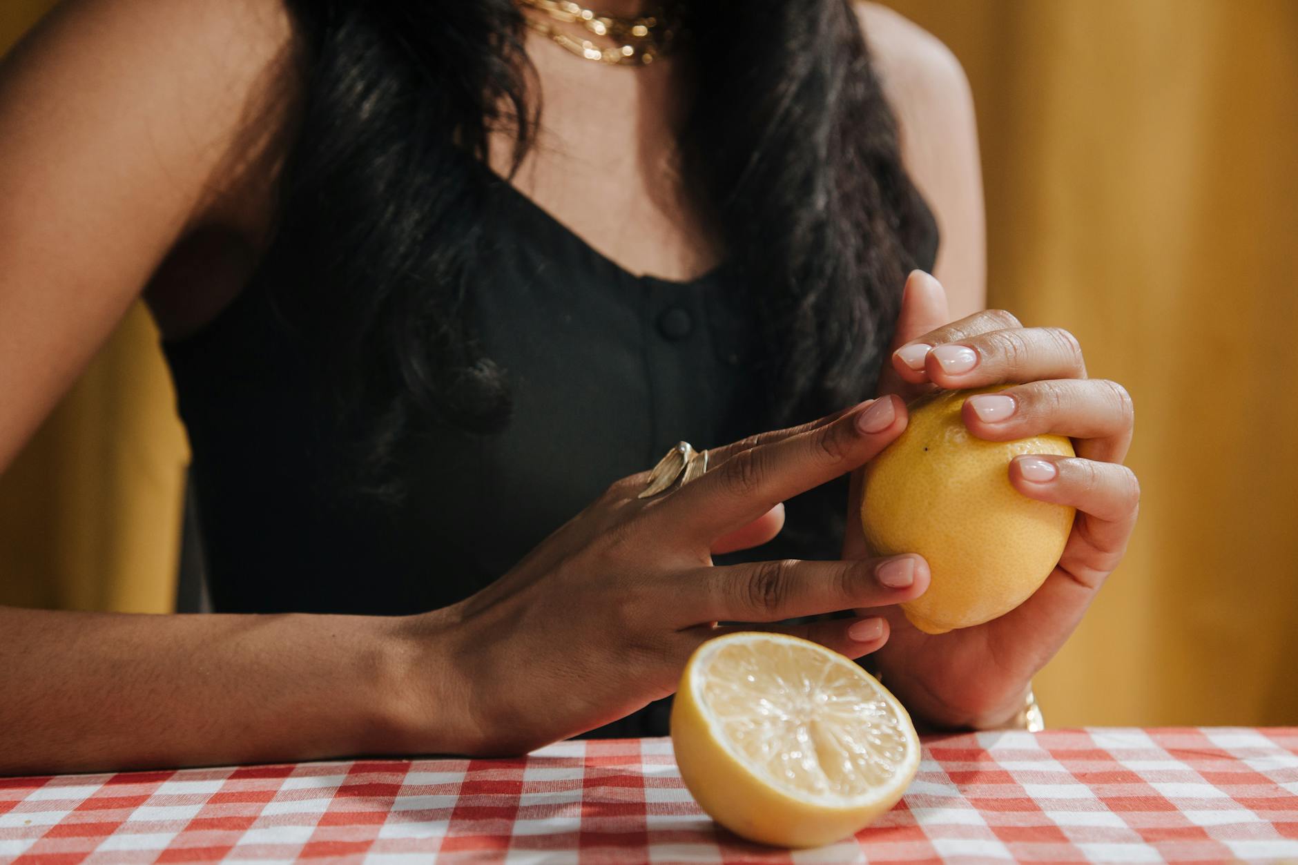 Bright ripe lemons arranged on a pastel background, symbolizing fresh starts and hormonal shifts