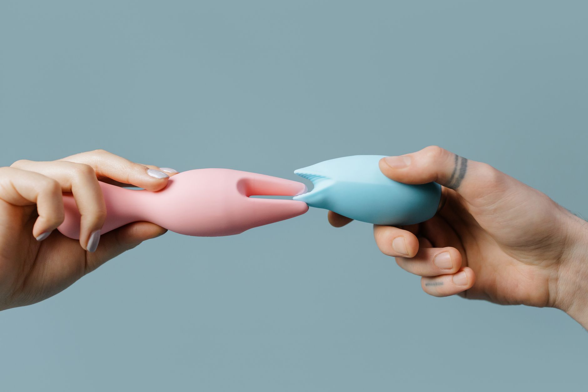 Woman holding colorful lemon vibrators and clitoral vibrators