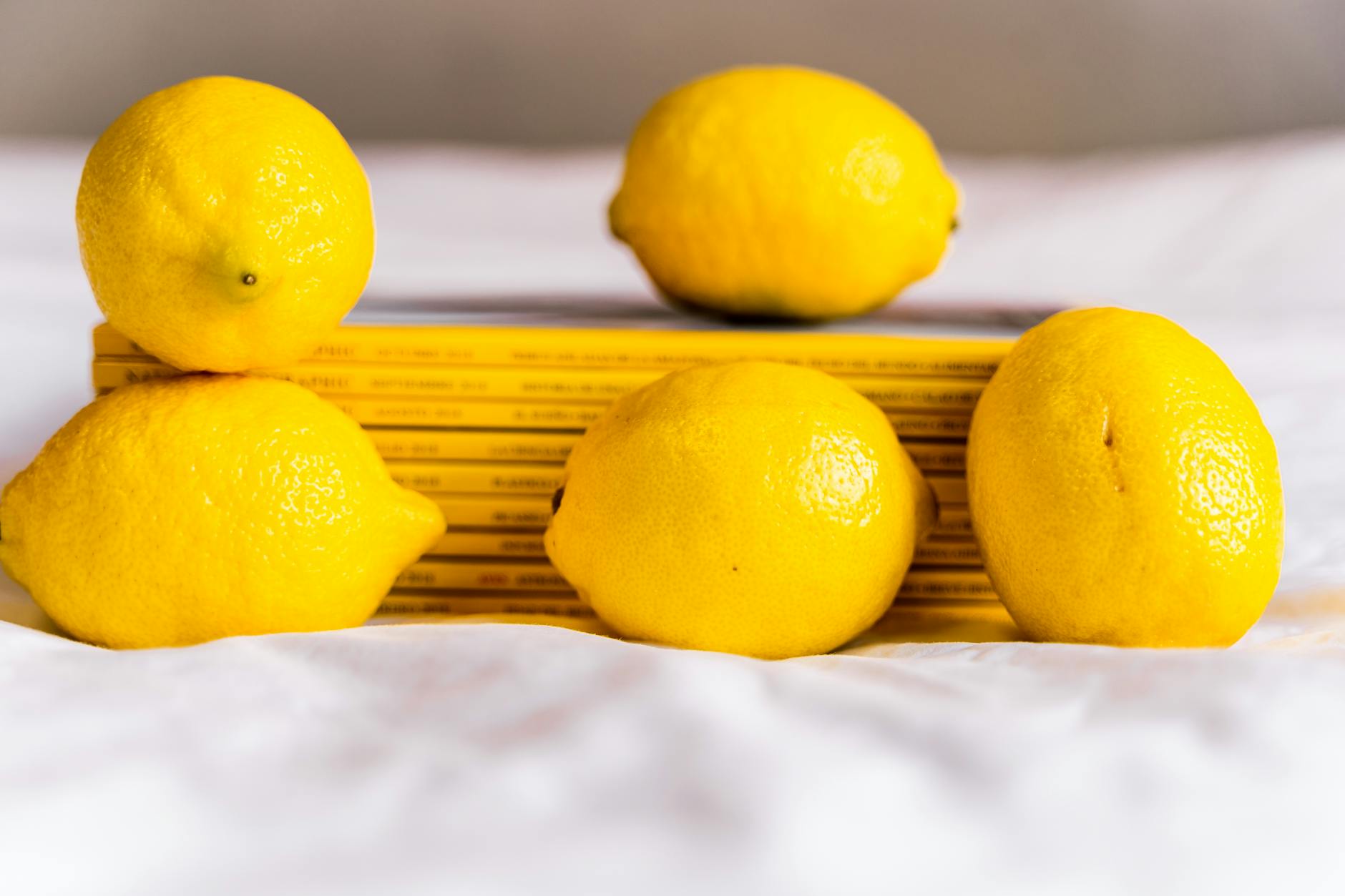 Fresh lemons held in cupped hands, symbolizing natural pleasure and exploration